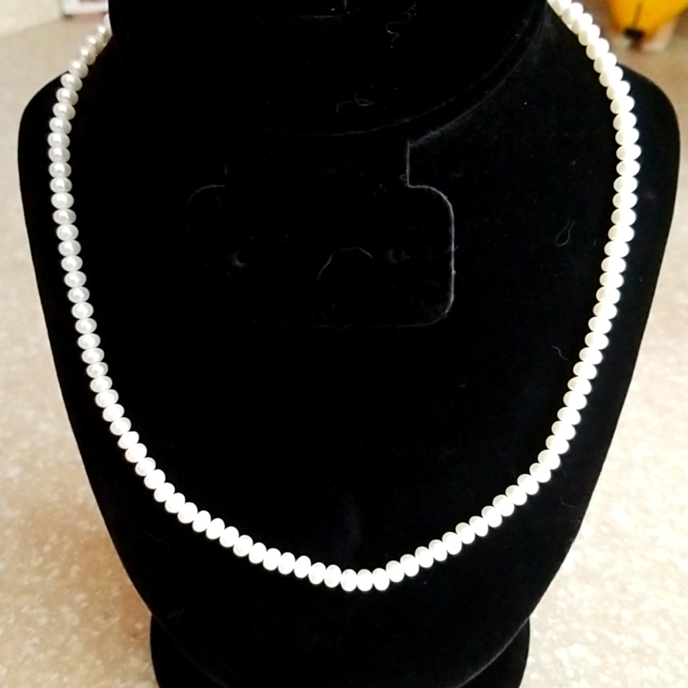 Freshwater Cultured Pearl Necklace 18" set in 10KT gold.